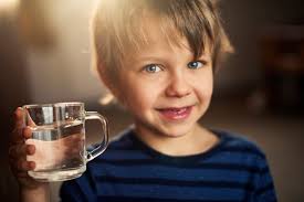 kid with water glass